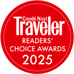 Red circular badge with white text: “Condé Nast Traveller Readers’ Choice Awards 2025.”